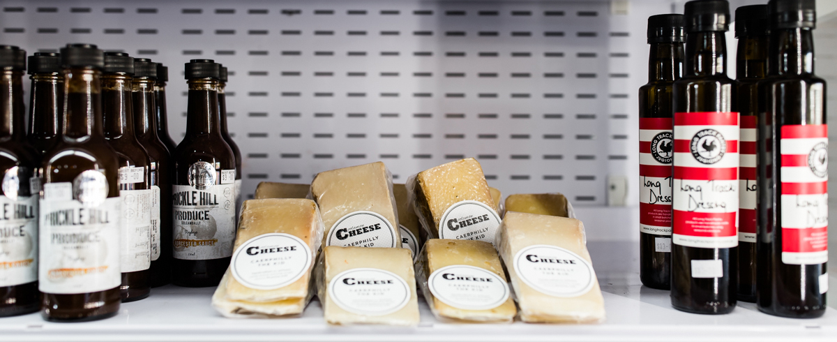 Packets of Coolamon Cheese and other grocery items in a fridge self serve for customers