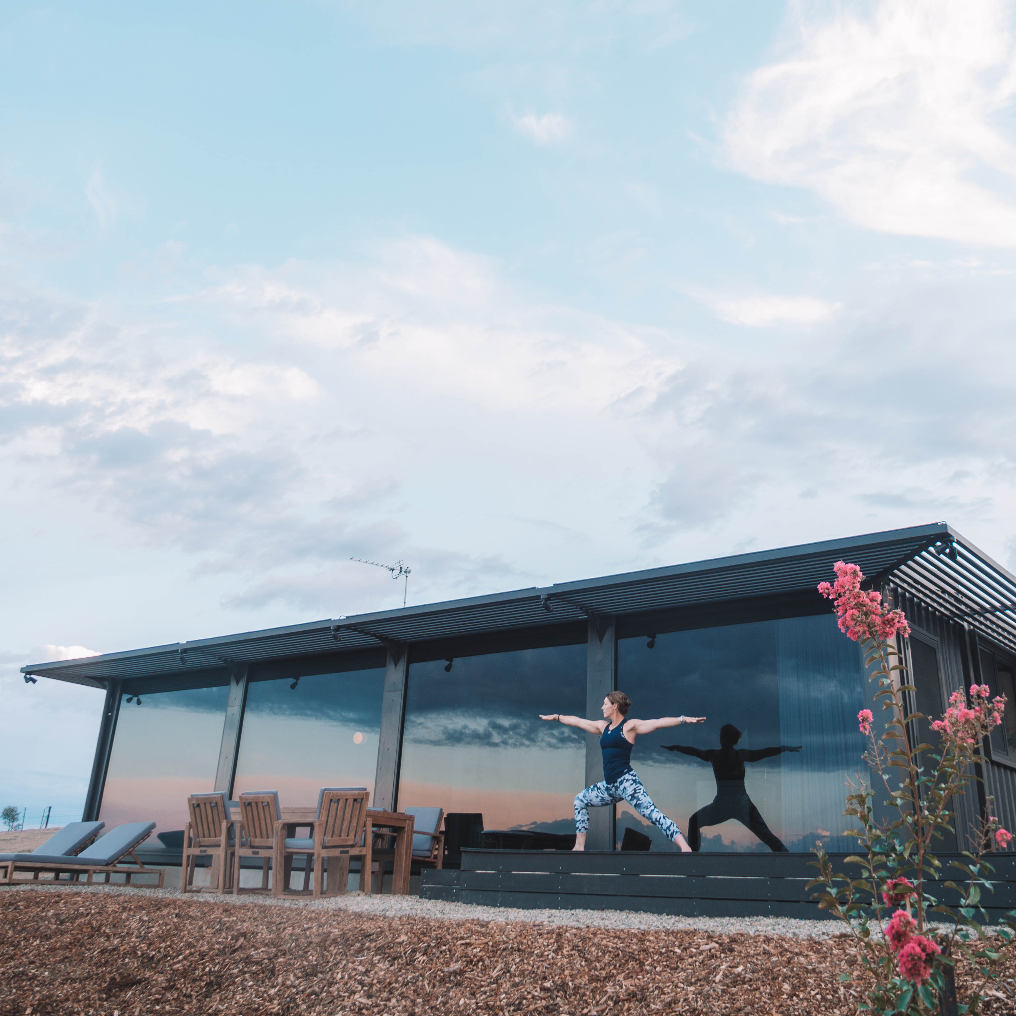 Yoga on the deck at Belisi Farmstay Cottages near Wagga Wagga